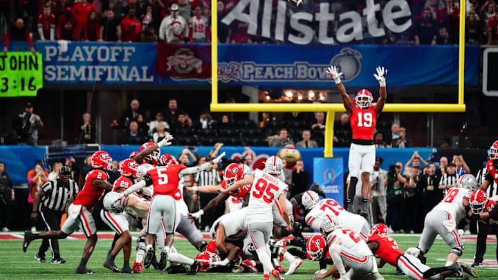 Dec 31, 2022; Atlanta, Georgia, USA; Ohio State Buckeyes place kicker Noah Ruggles (95) tries and misses a field goal against the Georgia Bulldogs during the final seconds of the fourth quarter of the 2022 Peach Bowl at Mercedes-Benz Stadium. Mandatory Credit: John David Mercer-Imagn Images Dec 31, 2022; Atlanta, Georgia, USA; Ohio State Buckeyes place kicker Noah Ruggles (95) tries and misses a field goal against the Georgia Bulldogs during the final seconds of the fourth quarter of the 2022 Peach Bowl at Mercedes-Benz Stadium. Mandatory Credit: John David Mercer-Imagn Images