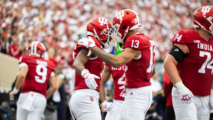 Indiana Hoosiers wide receiver Omar Cooper Jr. celebrates his touchdown with teammates in the first quarter against the Michigan Wolverines  at Memorial Stadium.