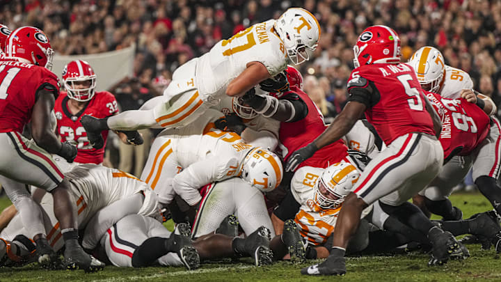 Nov 16, 2024; Athens, Georgia, USA; Tennessee Volunteers tight end Miles Kitselman (87) dives over the goal line for a touchdown against the Georgia Bulldogs during the first quarter at Sanford Stadium. Mandatory Credit: Dale Zanine-Imagn Images
