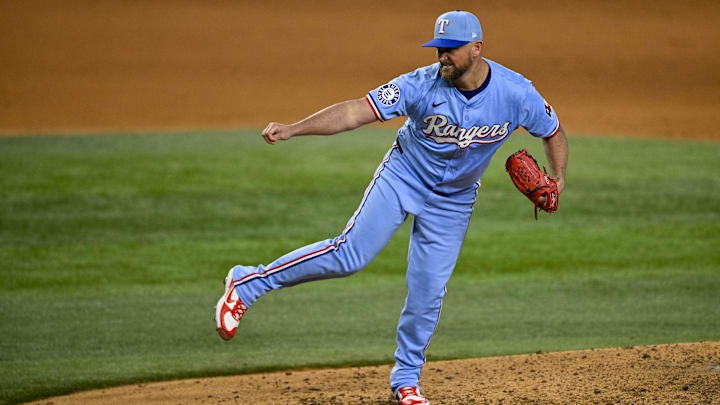 Sep 22, 2024; Arlington, Texas, USA; Texas Rangers relief pitcher Kirby Yates (39) pitches against the Seattle Mariners during the ninth inning at Globe Life Field. 