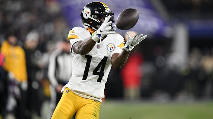 Jan 11, 2025; Baltimore, Maryland, USA; Pittsburgh Steelers wide receiver George Pickens (14) makes a catch against the Baltimore Ravens in the third quarter in an AFC wild card game at M&T Bank Stadium. Mandatory Credit: Tommy Gilligan-Imagn Images
