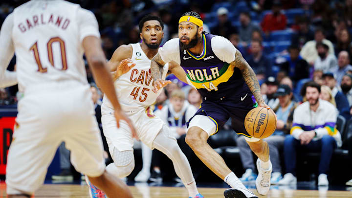 New Orleans Pelicans forward Brandon Ingram (14) drives to the basket against Cleveland Cavaliers guard Donovan Mitchell (45) during the third quarter at Smoothie King Center. Mandatory Credit: Andrew Wevers-Imagn Images