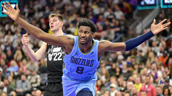 Dec 23, 2025; Salt Lake City, Utah, USA; Memphis Grizzlies forward/center Jaren Jackson Jr. (8) looks for a foul call during the first half against Utah Jazz center Kyle Filipowski (22) at Delta Center. Mandatory Credit: Peter Creveling-Imagn Images