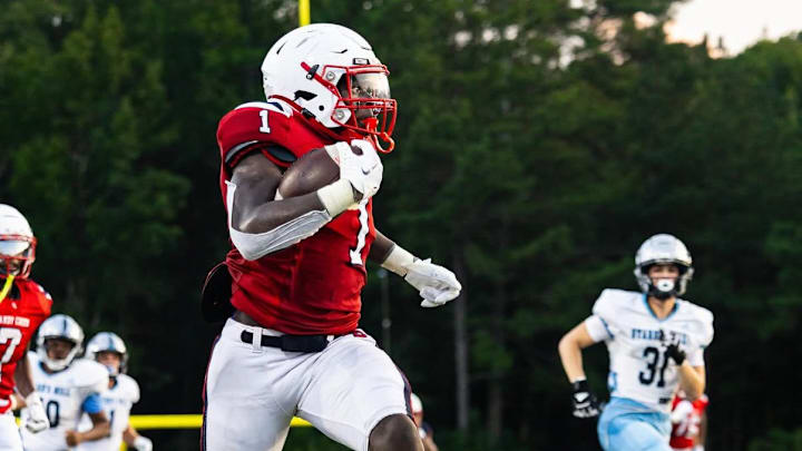 Sandy Creek senior running back Amari Latimer (1) breaks loose during a 2024 game. Latimer, who has signed with West Virginia, has rushed for 2,313 yards and 42 touchdowns to lead the Patriots to the Class AAA state title game against Jefferson on Dec. 17, 2025 in Atlanta.