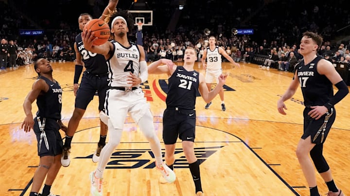 DJ Davis drives through the Xavier defense to score for Butler. DJ Davis drives through the Xavier defense to score for Butler.