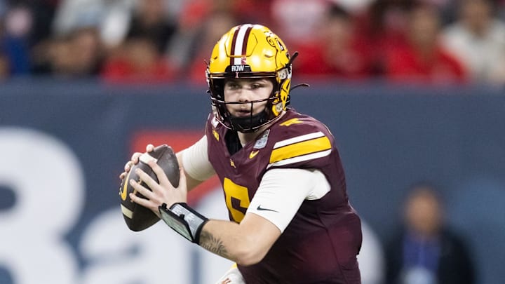 Dec 26, 2025; Phoenix, AZ, USA; Minnesota Gophers quarterback Drake Lindsey (5) against the New Mexico Lobos during the second half of the Rate Bowl at Chase Field. Mandatory Credit: Mark J. Rebilas-Imagn Images