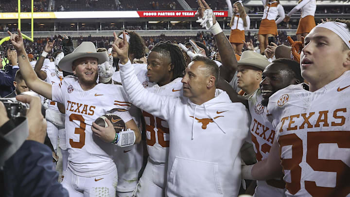 Texas coach Steve Sarkisian celebrates a win over Texas A&M with his team.