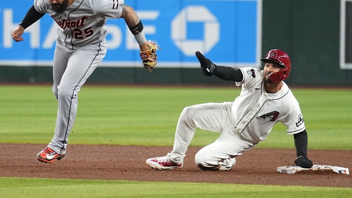 Arizona Diamondbacks base runner Jordan Lawlar (10) looks to the umpire after sliding in safely past Detroit Tigers infielder Gleyber Torres (25) at Chase Field on March 30, 2026.