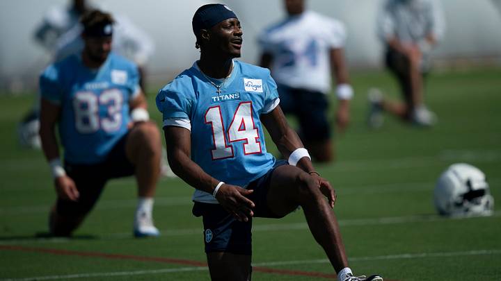 Tennessee Titans wide receiver Carnell Tate (14) stretches on the second day of training camp practice at Vanderbilt Health Football Center Friday, July 30, 2026. Tennessee Titans wide receiver Carnell Tate (14) stretches on the second day of training camp practice at Vanderbilt Health Football Center Friday, July 30, 2026.