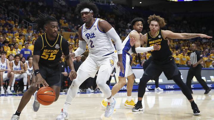 Nov 28, 2023; Pittsburgh, Pennsylvania, USA; Missouri Tigers guard Sean East II (55) drives the baseline against Pittsburgh Panthers forward Blake Hinson (2) during the first half at the Petersen Events Center.