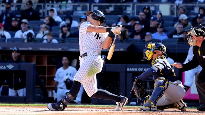 Mar 27, 2025; Bronx, New York, USA; New York Yankees shortstop Anthony Volpe (11) follows through on a solo home run against the Milwaukee Brewers during the second inning at Yankee Stadium. Mar 27, 2025; Bronx, New York, USA; New York Yankees shortstop Anthony Volpe (11) follows through on a solo home run against the Milwaukee Brewers during the second inning at Yankee Stadium.