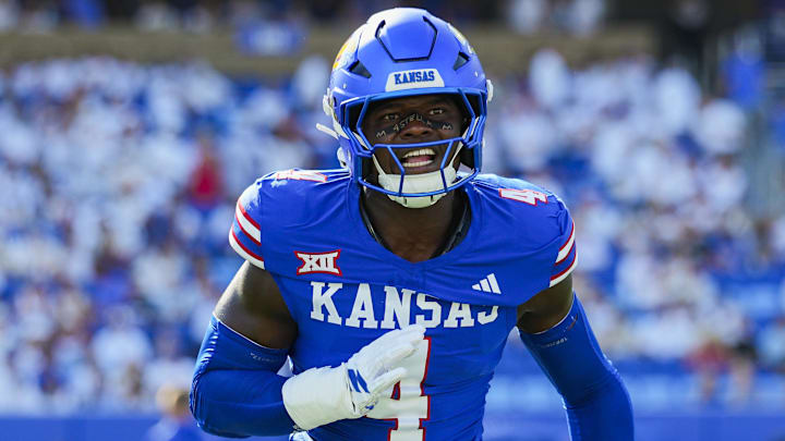 Aug 23, 2025; Lawrence, Kansas, USA; Kansas Jayhawks linebacker Trey Lathan (4) warms up prior to a game against the Fresno State Bulldogs at David Booth Kansas Memorial Stadium. Mandatory Credit: Jay Biggerstaff-Imagn Images