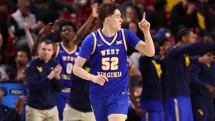 Jan 21, 2026; Tempe, Arizona, USA; West Virginia Mountaineers forward Treysen Eaglestaff (52) celebrates a shot against the Arizona State Sun Devils in the second half at Desert Financial Arena. Mandatory Credit: Mark J. Rebilas-Imagn Images