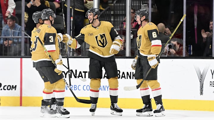 Oct 28, 2024; Las Vegas, Nevada, USA; Vegas Golden Knights center Nicolas Roy (10) celebrates his third-period goal with teammates against the Calgary Flames at T-Mobile Arena. Mandatory Credit: Candice Ward-Imagn Images