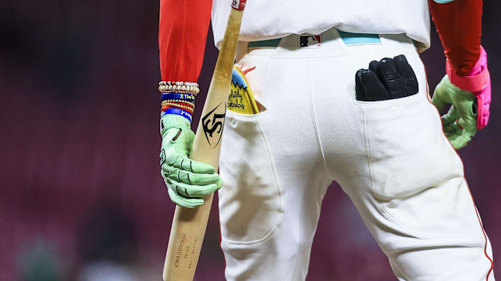 Mar 31, 2025; Cincinnati, Ohio, USA; A detail view as Cincinnati Reds shortstop Elly De La Cruz (44) holds his bat as he prepares to bat in the seventh inning against the Texas Rangers at Great American Ball Park. Mandatory Credit: Katie Stratman-Imagn Images Mar 31, 2025; Cincinnati, Ohio, USA; A detail view as Cincinnati Reds shortstop Elly De La Cruz (44) holds his bat as he prepares to bat in the seventh inning against the Texas Rangers at Great American Ball Park. Mandatory Credit: Katie Stratman-Imagn Images