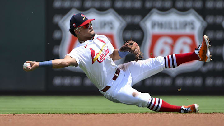 Aug 17, 2025; St. Louis, Missouri, USA;  St. Louis Cardinals shortstop Masyn Winn (0) throws from his knees to force out New York Yankees center fielder Trent Grisham (not pictured) during the first inning at Busch Stadium. Mandatory Credit: Jeff Curry-Imagn Images