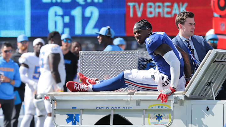 Sep 28, 2025; East Rutherford, New Jersey, USA; New York Giants wide receiver Malik Nabers (1) is carted off the field following an injury during the second quarter against the Los Angeles Chargers at MetLife Stadium. Mandatory Credit: Brad Penner-Imagn Images