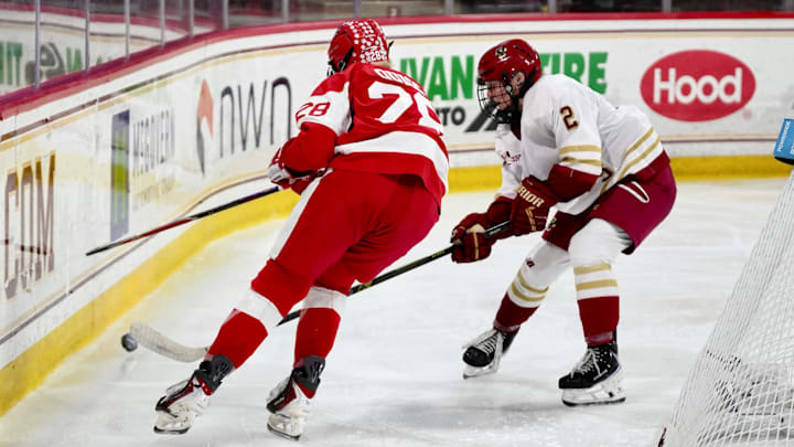Madelyn Murphy in a puck battle with Boston University's Kaileigh Quigg. 