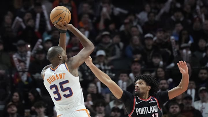 Feb 1, 2025; Portland, Oregon, USA; Phoenix Suns power forward Kevin Durant (35) shoots the ball over Portland Trail Blazers shooting guard Shaedon Sharpe (17) during the second half at Moda Center. Mandatory Credit: Soobum Im-Imagn Images