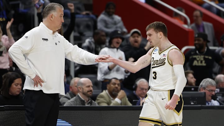 Purdue Boilermakers guard Braden Smith (3) bumps fist with head coach Matt Painter 