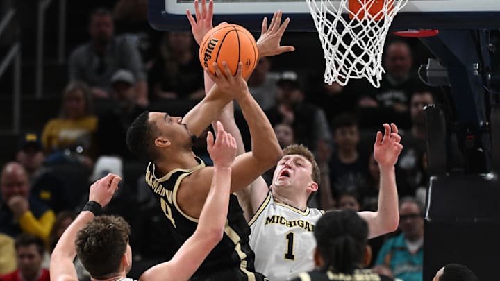 Purdue Boilermakers forward Trey Kaufman-Renn (4) shoots against Michigan Wolverines center Danny Wolf (1)