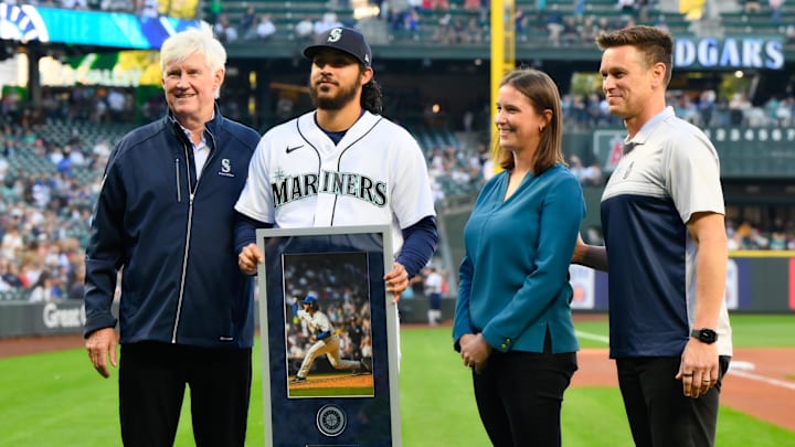 Seattle Mariners chairman John Stanton (left), President of Business Operations Catie Griggs (middle right) and president of baseball operations Jerry Dipoto (right) stand with reliever Andres Munoz before a game against the Los Angeles Angels on Sept. 11, 2023, at T-Mobile Park.