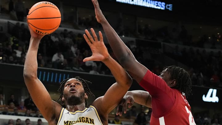 Mar 27, 2026; Chicago, IL, USA; Michigan Wolverines forward Morez Johnson Jr. (21) shoots the ball in the first half against the Alabama Crimson Tide during a Sweet Sixteen game of the Midwest Regional of the men's 2026 NCAA Tournament at United Center. Mandatory Credit: David Banks-Imagn Images