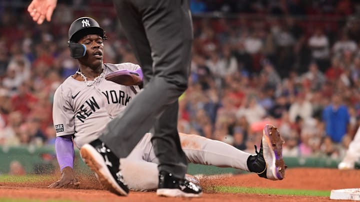 Jul 28, 2024; Boston, Massachusetts, USA; New York Yankees center fielder Jazz Chisholm Jr (13) steals third base against the Boston Red Sox during the ninth inning at Fenway Park. Mandatory Credit: Eric Canha-USA TODAY Sports