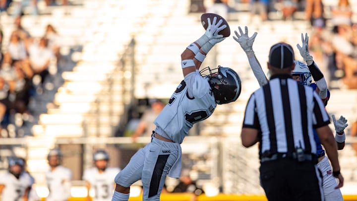 A Volcano Vista player intercepts a pass during a high school football at the Field of Dreams.