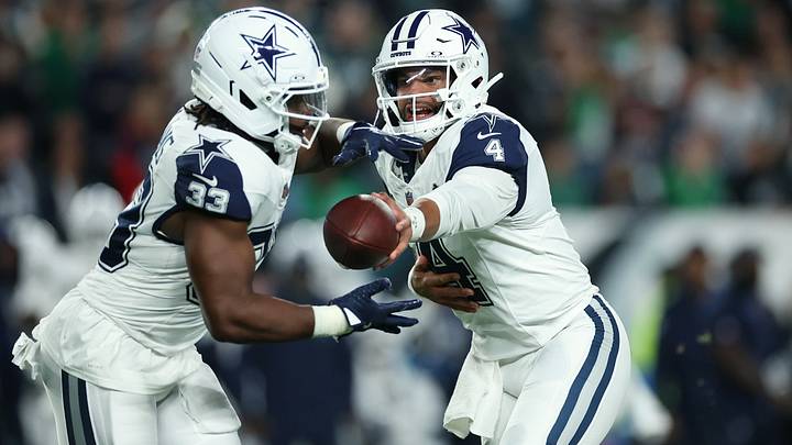 Dallas Cowboys quarterback Dak Prescott (4) hands the ball off to Dallas Cowboys running back Javonte Williams (33) during the first quarter against the Philadelphia Eagles at Lincoln Financial Field.  Mandatory Credit: Bill Streicher-Imagn Images