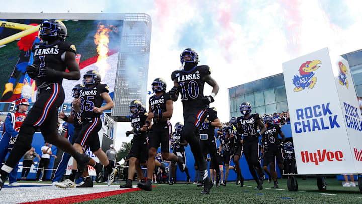Kansas Jayhawks run out before the game against West Virginia Mountaineers at David Booth Kansas Memorial Stadium on Sept. 20, 2025.