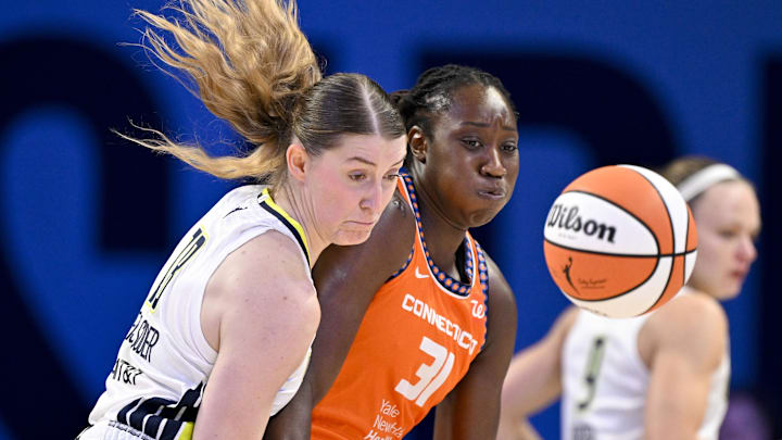 Dallas Wings center Luisa Geiselsoder (18) and Connecticut Sun center Tina Charles (31) battle for control of the ball during the first half at College Park Center. Dallas Wings center Luisa Geiselsoder (18) and Connecticut Sun center Tina Charles (31) battle for control of the ball during the first half at College Park Center.