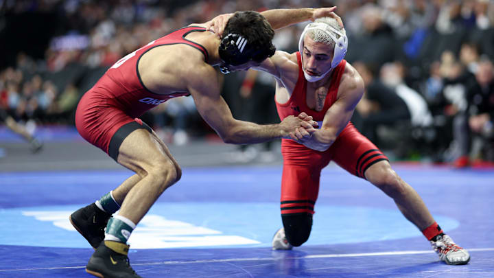 Mar 20, 2025; Philadelphia, PA, USA; Dean Peterson of Rutgers (R) wrestles Antonio Lorenzo (L) of Oklahoma during day one of the NCAA Wrestling championships at Wells Fargo Center. Mandatory Credit: Bill Streicher-Imagn Images