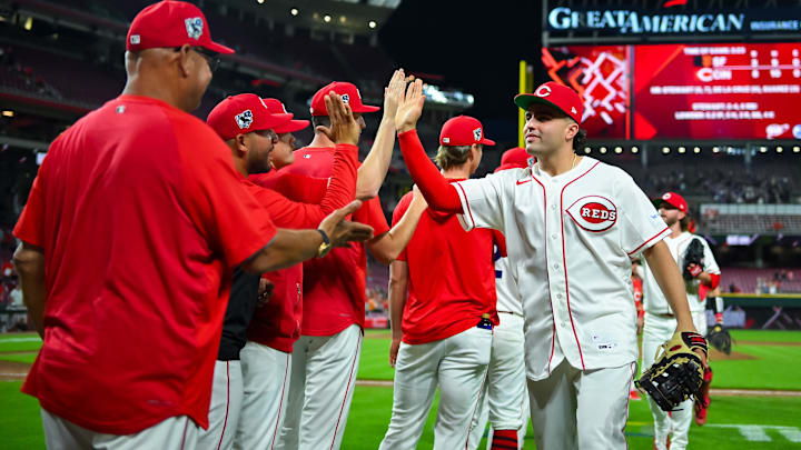 Apr 15, 2026; Cincinnati, Ohio, USA;  Cincinnati Reds third baseman Sal Stewart (27) high-fives teammates after defeating the San Francisco Giants at Great American Ball Park. Players and coaches will wear No. 42 in honor of Jackie Robinson Day around the league. Mandatory Credit: Aaron Doster-Imagn Images