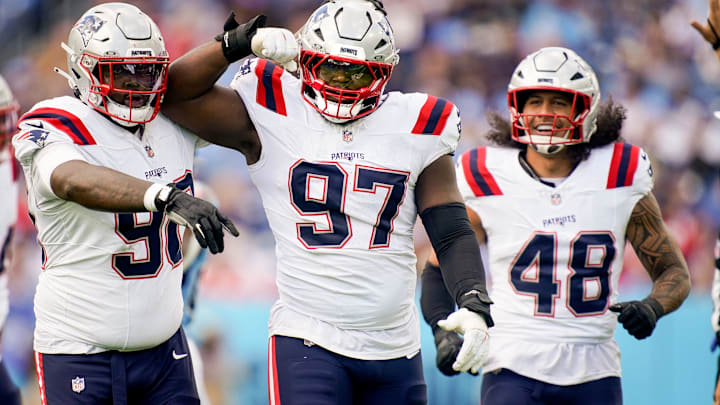 New England Patriots defensive end Milton Williams (97) celebrates sacking Tennessee Titans quarterback Cam Ward (1) during the third quarter at Nissan Stadium in Nashville, Tenn., Sunday, Oct. 19, 2025. New England Patriots defensive end Milton Williams (97) celebrates sacking Tennessee Titans quarterback Cam Ward (1) during the third quarter at Nissan Stadium in Nashville, Tenn., Sunday, Oct. 19, 2025.