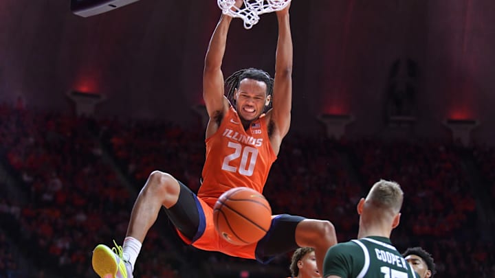 Jan 11, 2024; Champaign, Illinois, USA;  Illinois Fighting Illini forward Ty Rodgers (20) dunks the ball during the first half against the Michigan State Spartans at State Farm Center. Mandatory Credit: Ron Johnson-Imagn Images