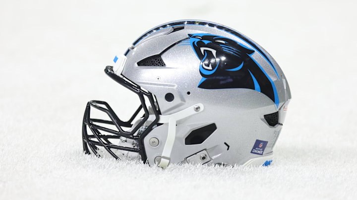 Dec 14, 2025; New Orleans, Louisiana, USA; Detailed shot of a Carolina Panthers helmet on the grass before the game against the New Orleans Saints at Caesars Superdome. Mandatory Credit: Stephen Lew-Imagn Images