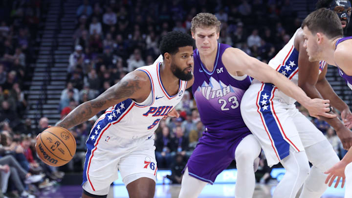 Dec 28, 2024; Salt Lake City, Utah, USA; Philadelphia 76ers forward Paul George (8) dribbles against Utah Jazz forward Lauri Markkanen (23) during the first quarter at Delta Center. Mandatory Credit: Rob Gray-Imagn Images
