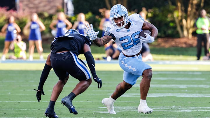 Sep 28, 2024; Durham, North Carolina, USA;  North Carolina Tar Heels running back Omarion Hampton (28) runs with the ball during the first half of the game against Duke Blue Devils at Wallace Wade Stadium.