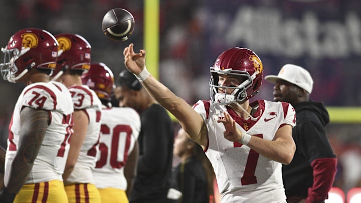 Oct 19, 2024; College Park, Maryland, USA;  Southern California Trojans quarterback Miller Moss (7) warms up on the sidelines during the second half against the Southern California Trojans at SECU Stadium. Mandatory Credit: Tommy Gilligan-Imagn Images