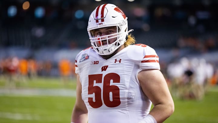 Dec 27, 2022; Phoenix, Arizona, USA; Wisconsin Badgers offensive lineman Joe Brunner (56) against the Oklahoma State Cowboys during the 2022 Guaranteed Rate Bowl at Chase Field.