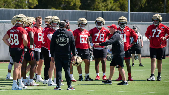 Jul 27, 2023; Santa Clara, CA, USA; San Francisco 49ers offensive line coach and run game coordinator Chris Foerster talks to a group of offensive lineman during training camp at the SAP Performance Facility. Mandatory Credit: Robert Edwards-USA TODAY Sports