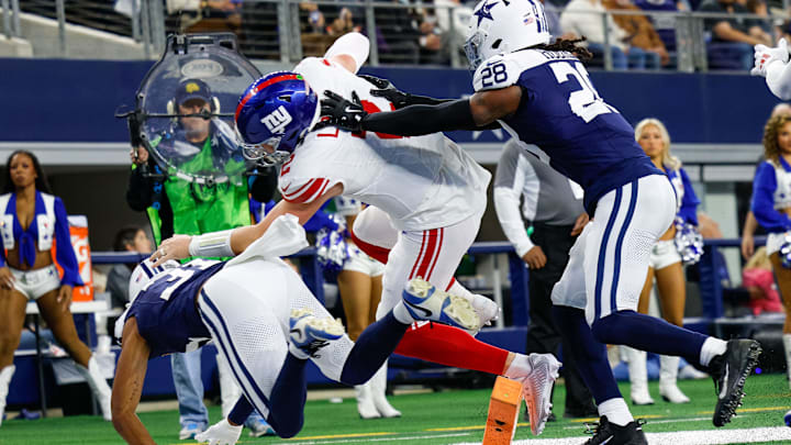 Nov 28, 2024; Arlington, Texas, USA; New York Giants quarterback Drew Lock (2) appears to have a touchdown but is overturned just short of the goal line with Dallas Cowboys safety Malik Hooker (28) defending during the first quarter at AT&T Stadium. Nov 28, 2024; Arlington, Texas, USA; New York Giants quarterback Drew Lock (2) appears to have a touchdown but is overturned just short of the goal line with Dallas Cowboys safety Malik Hooker (28) defending during the first quarter at AT&T Stadium.