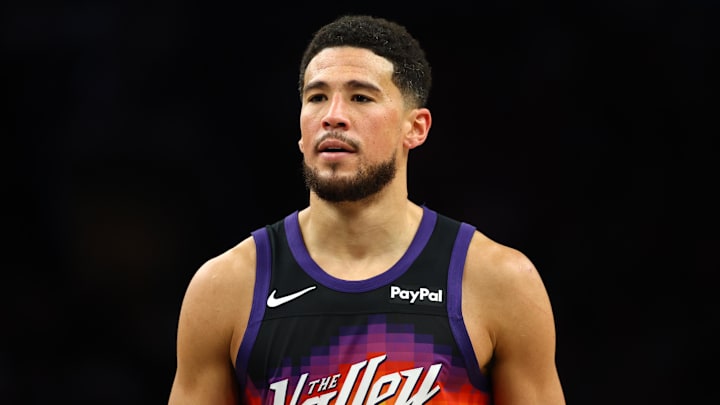 Mar 28, 2026; Phoenix, Arizona, USA; Phoenix Suns guard Devin Booker (1) against the Utah Jazz in the second half at Mortgage Matchup Center. Mandatory Credit: Mark J. Rebilas-Imagn Images