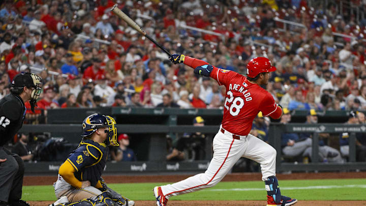 Sep 19, 2025; St. Louis, Missouri, USA;  St. Louis Cardinals third baseman Nolan Arenado (28) hits a three run double against the Milwaukee Brewers during the fifth inning at Busch Stadium. Mandatory Credit: Jeff Curry-Imagn Images