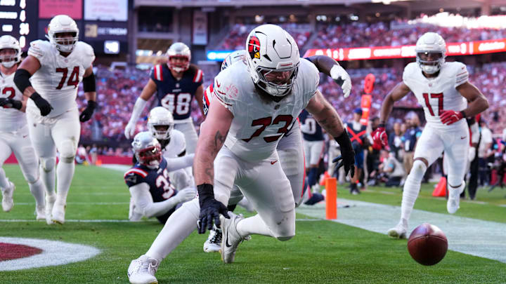 Dec 15, 2024; Glendale, Arizona, USA; Arizona Cardinals offensive tackle Jonah Williams (73) dives on a fumble for a touchdown during the first half at State Farm Stadium. Mandatory Credit: Joe Camporeale-Imagn Images