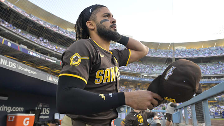 Oct 11, 2024; Los Angeles, California, USA; San Diego Padres outfielder Fernando Tatis Jr. (23) looks on from the dugout before game five against the Los Angeles Dodgers in the NLDS for the 2024 MLB Playoffs at Dodger Stadium. Mandatory Credit: Jayne Kamin-Oncea-Imagn Images Oct 11, 2024; Los Angeles, California, USA; San Diego Padres outfielder Fernando Tatis Jr. (23) looks on from the dugout before game five against the Los Angeles Dodgers in the NLDS for the 2024 MLB Playoffs at Dodger Stadium. Mandatory Credit: Jayne Kamin-Oncea-Imagn Images