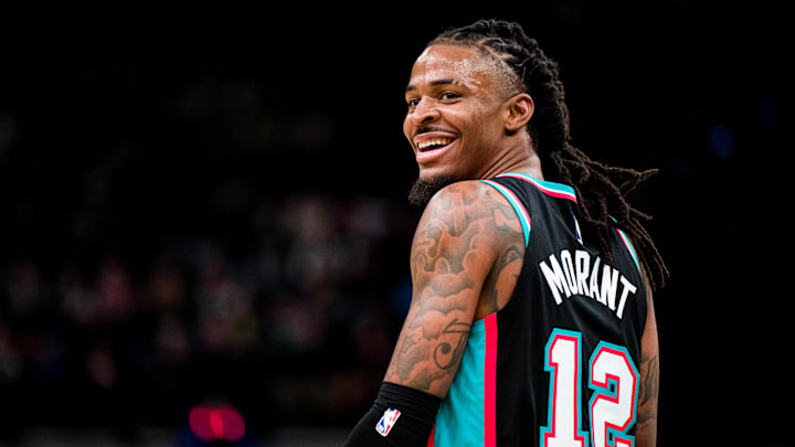 Dec 12, 2025; Memphis, Tennessee, USA; Memphis Grizzlies point guard Ja Morant (12) smiles at the Utah Jazz bench after forcing a turnover in the second half at FedExForum. Mandatory Credit: Matthew Smith-Imagn Images