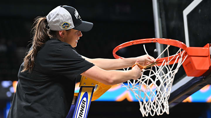 Mar 30, 2025; Spokane, WA, USA; UCLA Bruins guard Gabriela Jaquez (11) cuts part of the net after a Elite 8 NCAA Tournament basketball game against the LSU Lady Tigers at Spokane Arena. Mandatory Credit: James Snook-Imagn Images