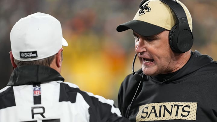 Dec 23, 2024; Green Bay, Wisconsin, USA; New Orleans Saints head coach Darren Rizzi argues with referee Alex Kemp (55) during the first quarter against the Green Bay Packers at Lambeau Field. Mandatory Credit: Jeff Hanisch-Imagn Images Dec 23, 2024; Green Bay, Wisconsin, USA; New Orleans Saints head coach Darren Rizzi argues with referee Alex Kemp (55) during the first quarter against the Green Bay Packers at Lambeau Field. Mandatory Credit: Jeff Hanisch-Imagn Images